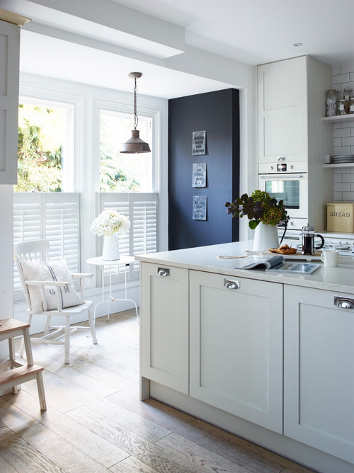 Café style shutters fitted to a bay window