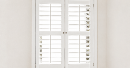 Tier-on-Tier plantation shutters in a living room window